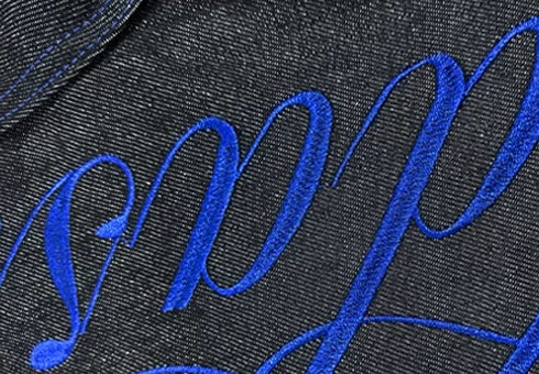 Script Embroidered Star Raw Denim Flare Jeans - Black script embroidery detail