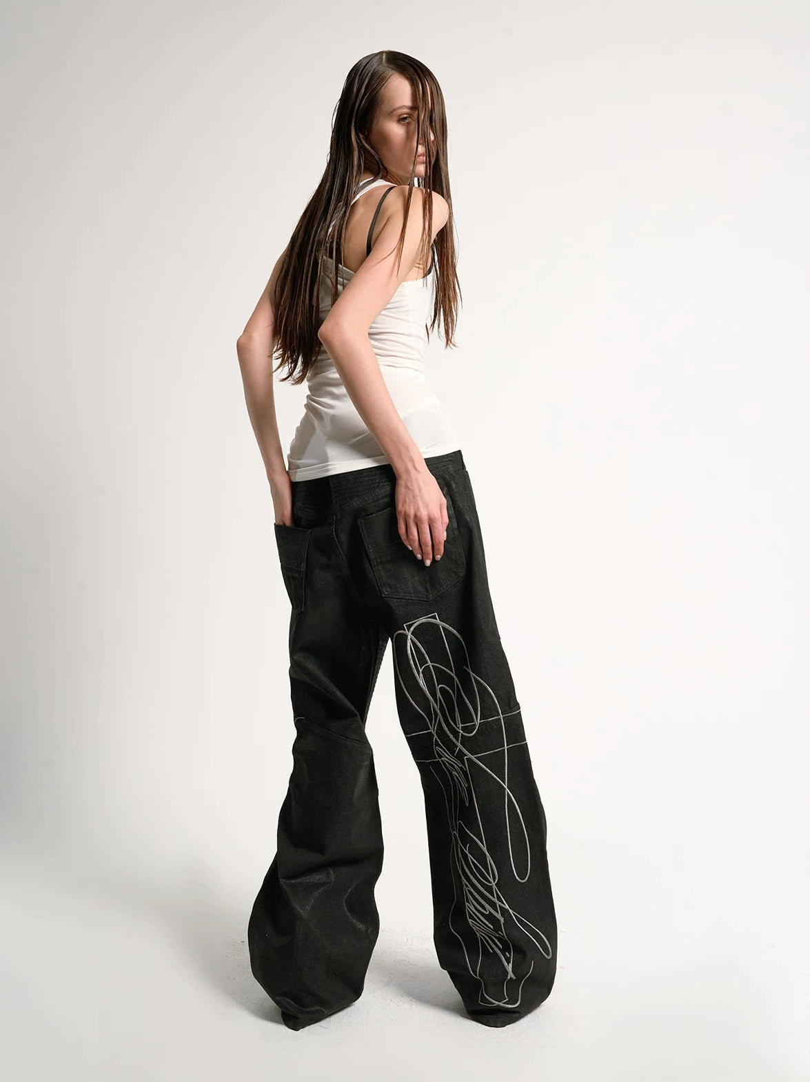 Waxed Embroidered Moto Baggy Straight Jeans - Black back view on model