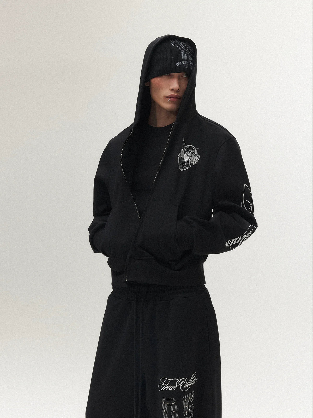 True Villain Studded Zip-Up Hoodie & Sweatpants - Black hoodie close-up on model