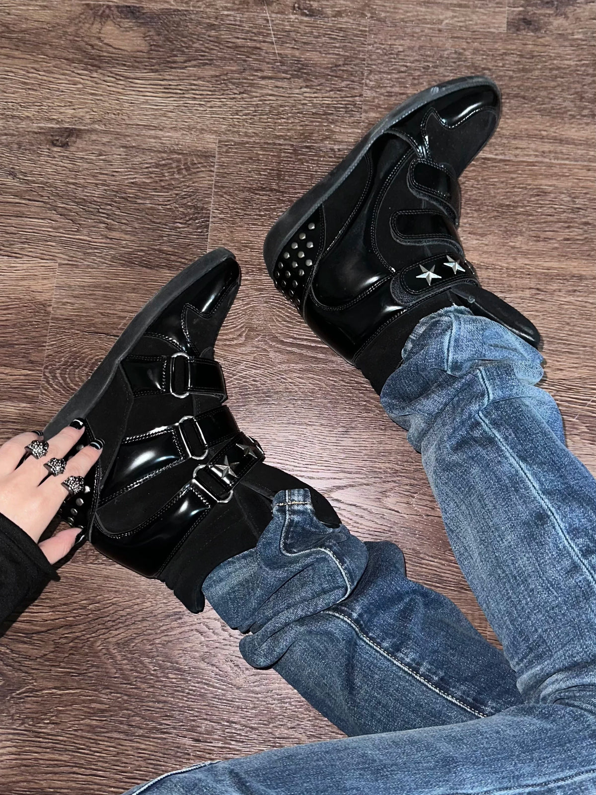 noEmosen Star Studded High-Top Wedge Sneakers - Black worn with jeans