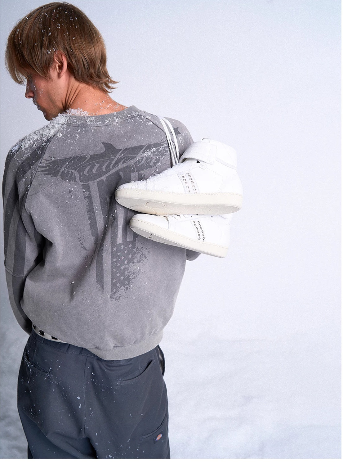 noEmosen Studded Leather High-Top Sneakers - White carried over shoulder - lookbook